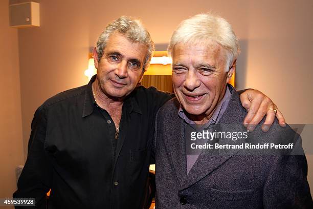 Humorists Michel Boujenah and Guy Bedos pose after the 'Ma Vie Revee' : Michel Boujenah One Man Show at Theatre Edouard VII on November 24, 2014 in...