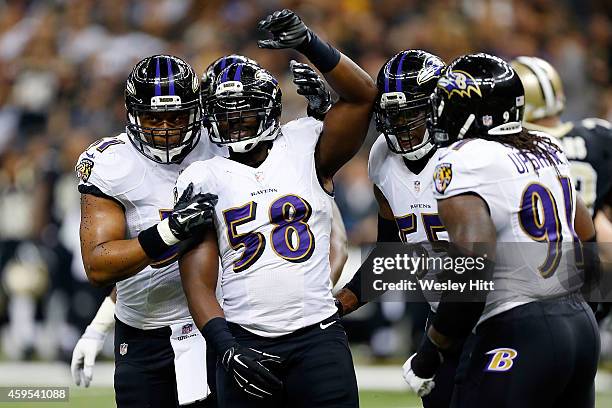 Elvis Dumervil of the Baltimore Ravens celebrates a sack against the New Orleans Saints during the second quarter of a game at the Mercedes-Benz...