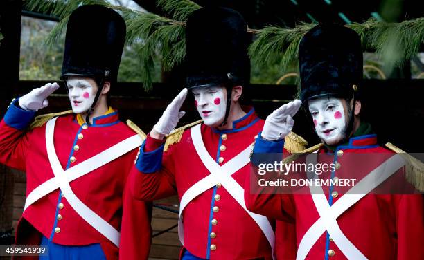 Singers dressed as toy soldiers perform during the Wildlife Conservation Society's Bronx Zoo "Salute to Wildlife Ice Carving Week" on December 27,...