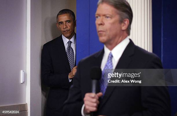 President Barack Obama comes into the James Brady Press Briefing Room for a statement following the announcement of the grand jury's decision in the...