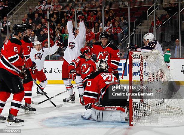 Artem Anisimov of the Columbus Blue Jackets celebrates his goal at 7:42 of he first period against Martin Brodeur of the New Jersey Devils at the...