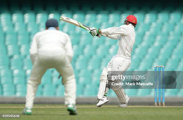 Phillip Hughes of South Australia is struck in the head by a delivery during day one of the Sheffield Shield match between New South Wales and South...