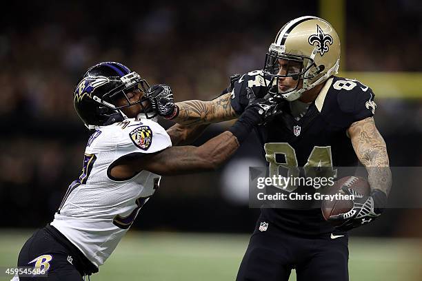Kenny Stills of the New Orleans Saints is pursued by Danny Gorrer of the Baltimore Ravens during the fourth quarter of a game at the Mercedes-Benz...