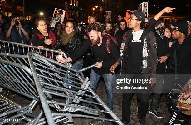 Protesters remove barricades as they marched from Union Square to Times Square after learning at police officer Darren Wilson, of the Ferguson, MO...