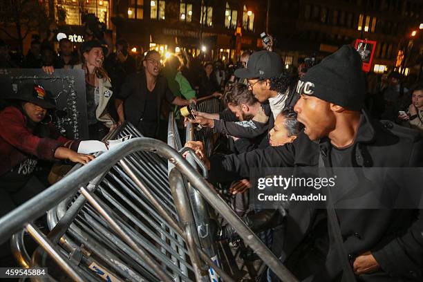 Protesters remove barricades as they marched from Union Square to Times Square after learning at police officer Darren Wilson, of the Ferguson, MO...