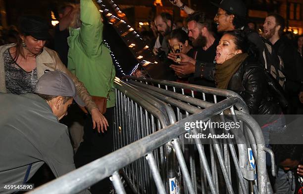 Protesters remove barricades as they marched from Union Square to Times Square after learning at police officer Darren Wilson, of the Ferguson, MO...