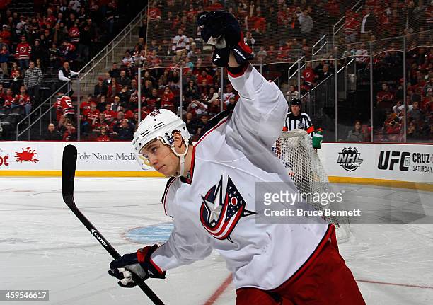 Playing in his 100th NHL game, Cam Atkinson of the Columbus Blue Jackets scores the game winning goal during the shootout against the New Jersey...