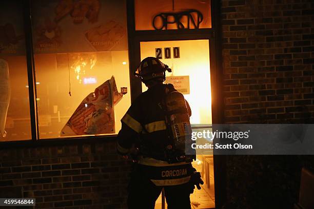 Restaurant burns after it was set on fire when protestors rioted following the grand jury announcement in the Michael Brown case on November 24, 2014...