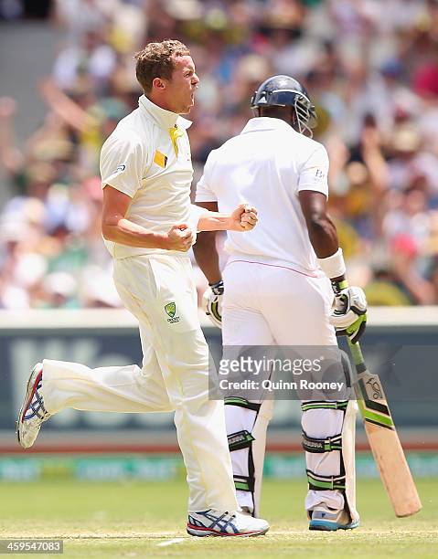 Peter Siddle of Australia celebrates after taking the wicket of Michael Carberry of England during day three of the Fourth Ashes Test Match between...