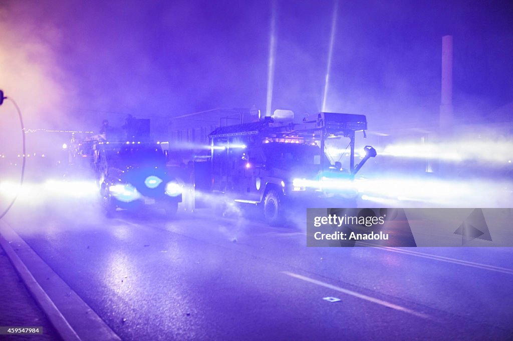 Protesters and police clash in Ferguson after grand jury decision