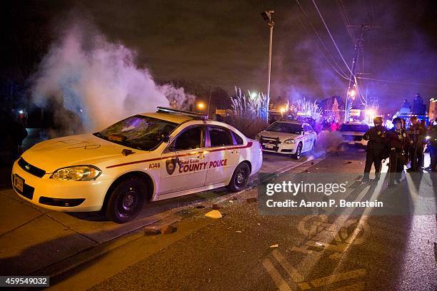 Police car is destroyed during rioting on November 24, 2014 in Ferguson, Missouri. A St. Louis County grand jury has declined to indict Ferguson...