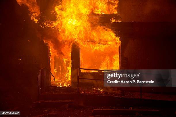 Public Storage building burns during rioting on November 24, 2014 in Ferguson, Missouri. A St. Louis County grand jury has declined to indict...