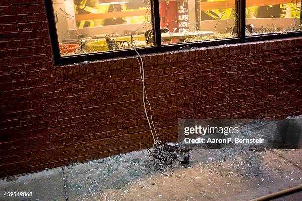 Window is broken out of a business during rioting on November 24, 2014 in Ferguson, Missouri. A St. Louis County grand jury has declined to indict...