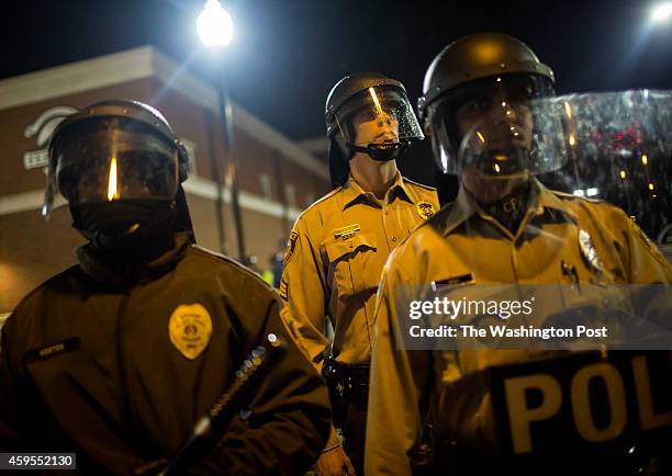 Law enforcement outside the Ferguson Police Department November 22, 2014 in Ferguson, Missouri. Tensions in Ferguson remain high as a grand jury is...