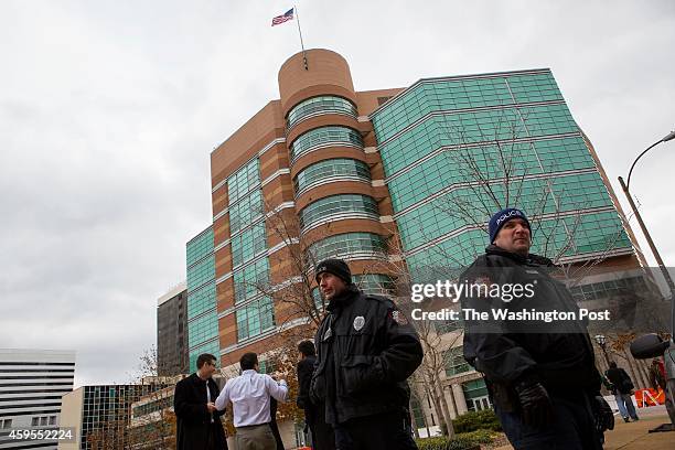 Media and police are seen outside the Buzz Westfall Justice Center where St. Louis County grand jury is considering whether or not to charge Officer...