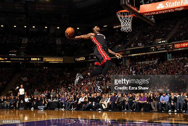 LeBron James of the Miami Heat dunks the ball during their game against the Sacramento Kings at Sleep Train Arena on December 27, 2013 in Sacramento,...