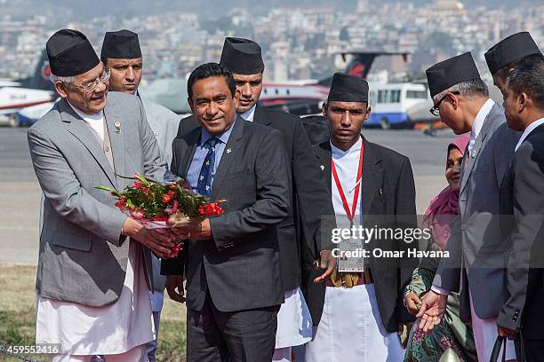 Abdulla Yameen, President of the Maldives is greeted by the Deputy Prime Minister of Nepal Bam Dev Gautam as he arrives at Tribhuvan International...