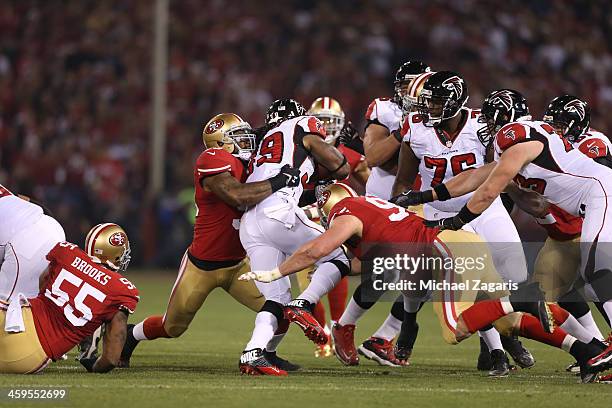 NaVorro Bowman and Justin Smith of the San Francisco 49ers stop Steven Jackson of the Atlanta Falcons during the game at Candlestick Park on December...
