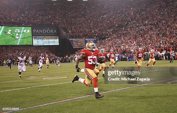 NaVorro Bowman of the San Francisco 49ers returns an interception 89-yards for a touchdown during the game against the Atlanta Falcons at Candlestick...