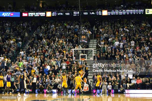 Derrick Favors of the Utah Jazz dunks teammate Gordon Hayward's rebound to take the last second lead over the Los Angeles Lakers at EnergySolutions...