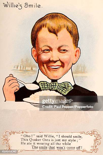 Vintage illustration featuring a young boy smiling whilst eating his Quaker Oats, circa 1930.