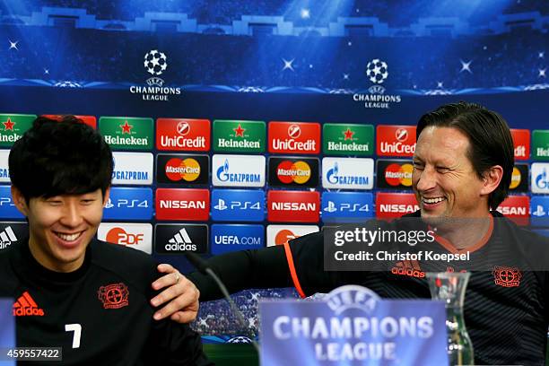 Heung-Min Son and head coach Roger Schmidt of Leverkusen attend a press conference ahead of their UEFA Champions League Group C match between Bayer...