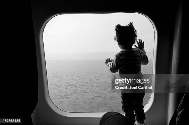palestinian girl looking at sea on gulf of aqaba ferry - nuweiba stock pictures, royalty-free photos & images