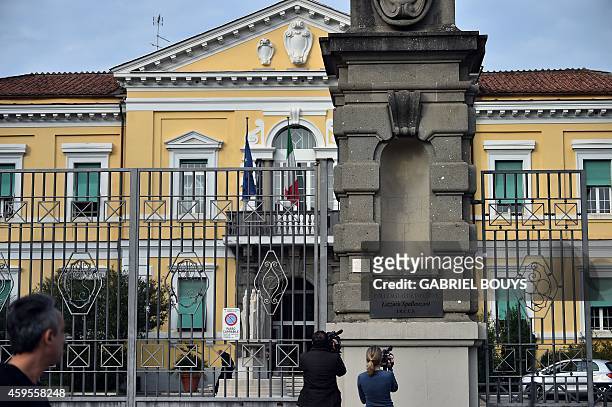 Journalists stand in front of the main entrance of the Lazzaro Spallanzani Institute in Rome on November 25, 2014. A doctor, 50-years old from Sicily...