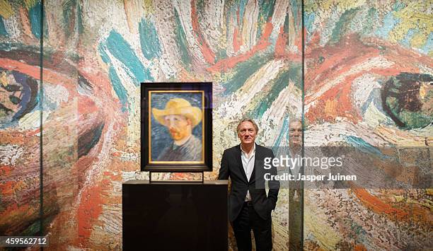 Great-grandchild of Vincent van Gogh's brother Theo, Willem van Gogh, poses next to a self portrait of Dutch Post-Impressionist painter Vincent van...