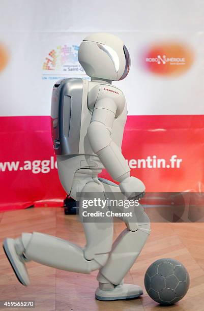 Honda Motors demonstrates its ASIMO robot during the 'Robonumerique' exhibition on November 2014 in St Quentin, France. ASIMO is a humanoid robot...