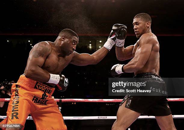 Anthony Joshua in action with Michael Sprott during their Eliminator for the British Heavyweight Championship at Liverpool Echo Arena on November 22,...