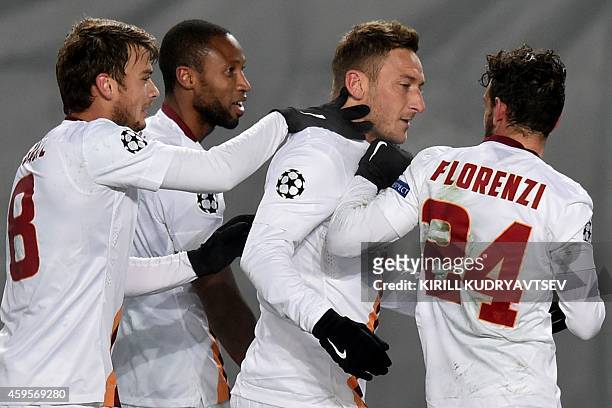 Roma's forward Francesco Totti celebrates with his teammates scoring a goal at Khimki arena outside Moscow on November 25 during their UEFA Champions...