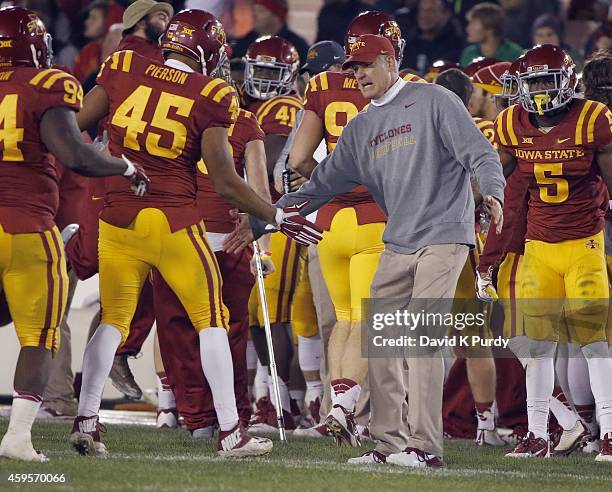 Head coach Paul Rhoads of the Iowa State Cyclones celebrates defensive end Dale Pierson of the Iowa State Cyclones on the sidelines in the second...