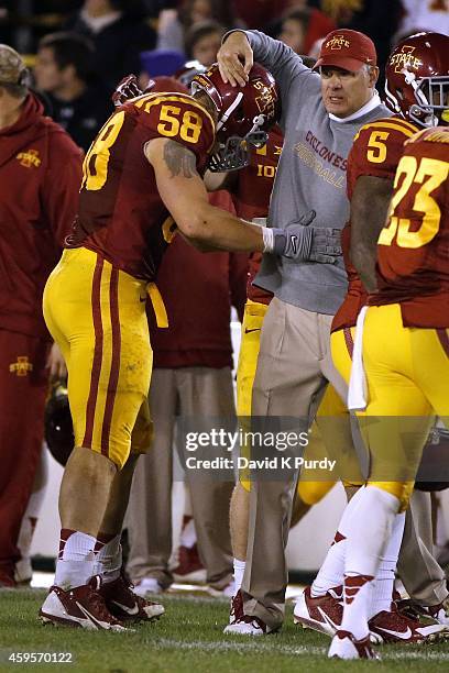 Head coach Paul Rhoads of the Iowa State Cyclones celebrates with defensive end Cory Morrissey of the Iowa State Cyclones after Morrissey recovered a...