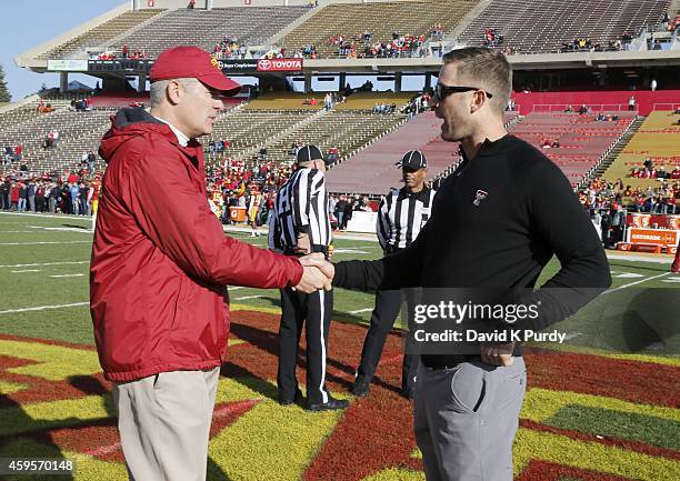 Head coach Paul Rhoads of the Iowa State Cyclones and head coach Kliff Kingsbury of the Texas Tech Red Raiders meet at mid field during warm up...