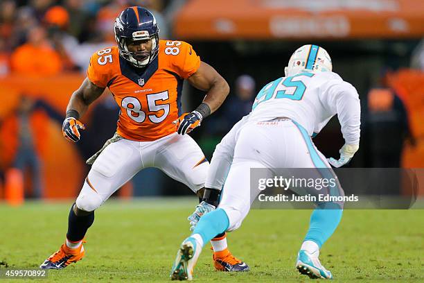 Tight end Virgil Green of the Denver Broncos blocks defensive end Dion Jordan of the Miami Dolphins during a game at Sports Authority Field at Mile...