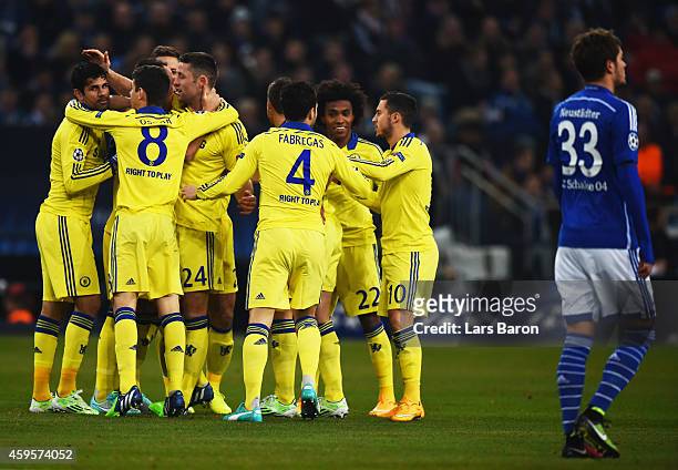 Roman Neustaedter of Schalke looks dejected as Chelsea players celebrate as John Terry scores their first goal during the UEFA Champions League Group...