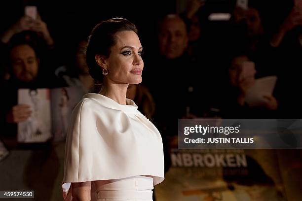 Director and actress Angelina Jolie poses on the red carpet for the UK premiere of the film "Unbroken" at Leicester Square in London on November 25,...