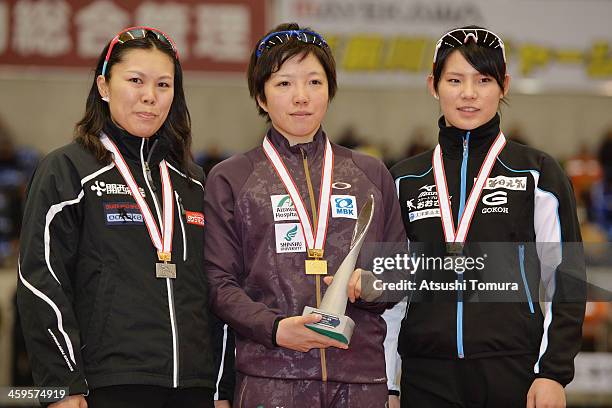 Maki Tsuji of Japan poses with the silver medal, Nao Kodaira of Japan poses with the gold medal and Erina Kamiya of Japan poses with the bronze medal...