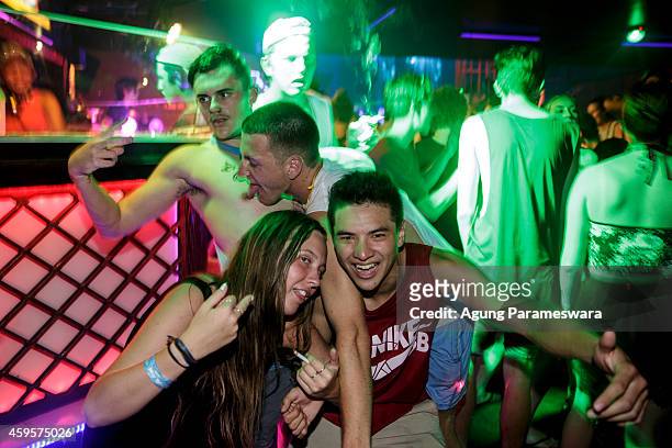 Teenagers party in a nightclub during Australian 'schoolies' celebrations on November 26, 2014 in Kuta, Bali, Indonesia. This year around 6,000...