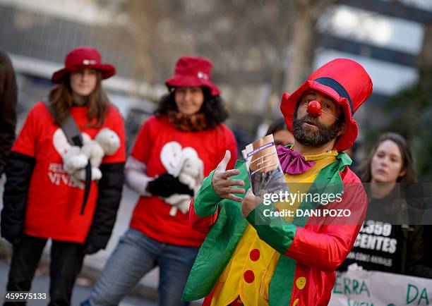 Jesus Poveda, president of the Provida Association of Madrid, talks, dressed up as a clown, during a gathering against abortion in front of the...