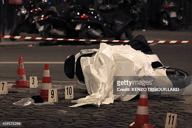Photo taken on November 25, 2014 in Paris' 15th arrondissement shows the motor scooter used by two alleged robbers who targeted a Cartier jewellery...