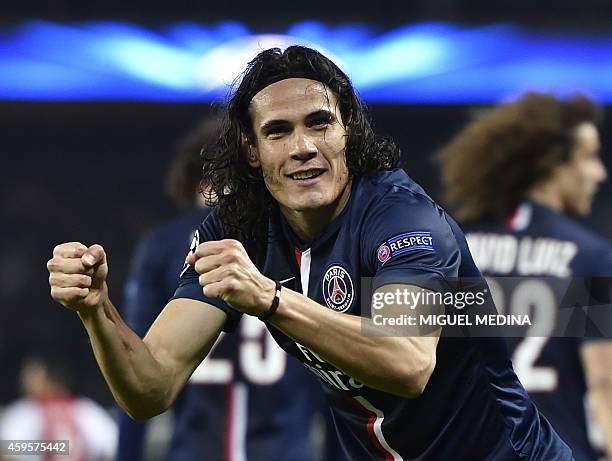 Paris Saint-Germain's Uruguyan forward Edinson Cavani gestures as he celebrates after scoring a goal during the UEFA Champions League group F...