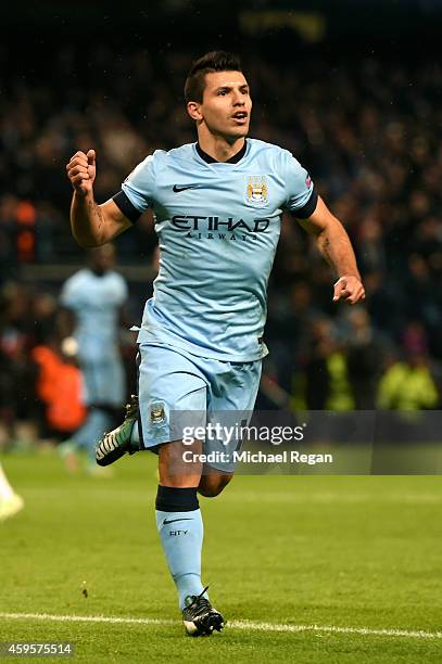 Sergio Aguero of Manchester City celebrates after scoring the opening goal from the penalty spot during the UEFA Champions League Group E match...