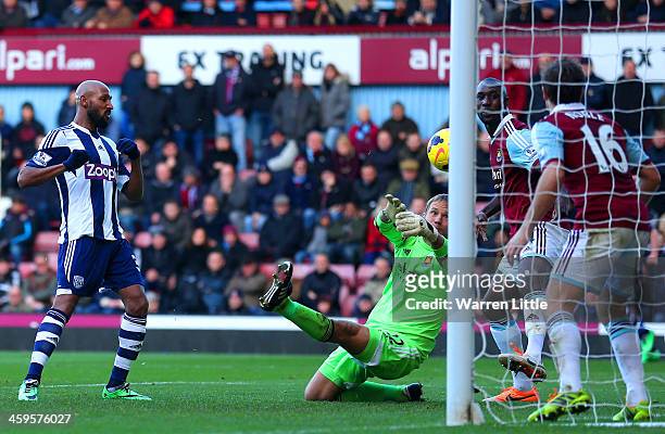 Nicolas Anelka of West Brom scores their second goal past Jussi Jaaskelainen of West Ham during the Barclays Premier League match between West Ham...