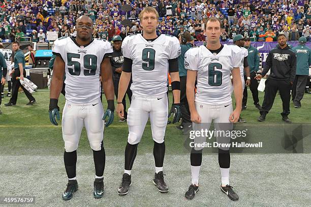 DeMeco Ryans, Nick Foles and Alex Henery of the Philadelphia Eagles pose for a captains photo against Minnesota Vikings at Mall of America Field on...