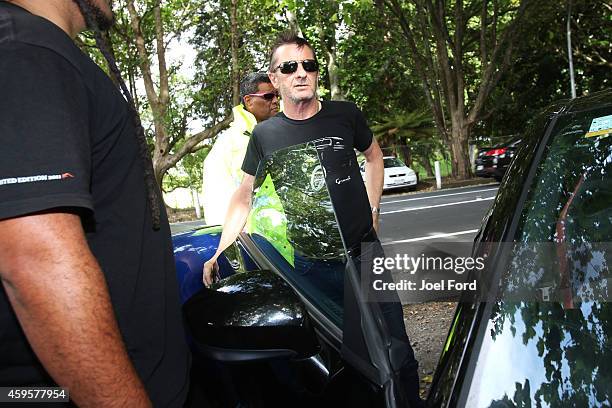 Drummer Phil Rudd talks to members of the media after leaving Tauranga District Court after appearing in court after being charged with threatening...