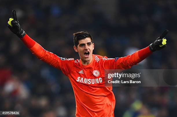 Thibaut Courtois of Chelsea celebrates as Didier Drogba of Chelsea scores their fourth goal during the UEFA Champions League Group G match between FC...