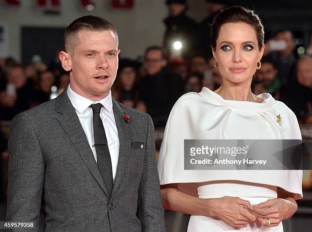 Actor Jack O'Connell and director Angelina Jolie attend the UK Premiere of "Unbroken" at Odeon Leicester Square on November 25, 2014 in London,...