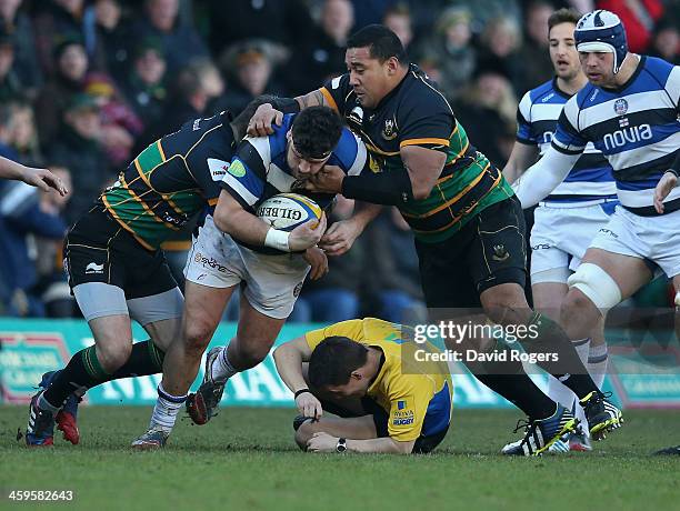 Luke Pearce, the referee is knocked down as Rob Webber of Bath is tackled during the Aviva Premiership match between Northampton Saints and Bath at...